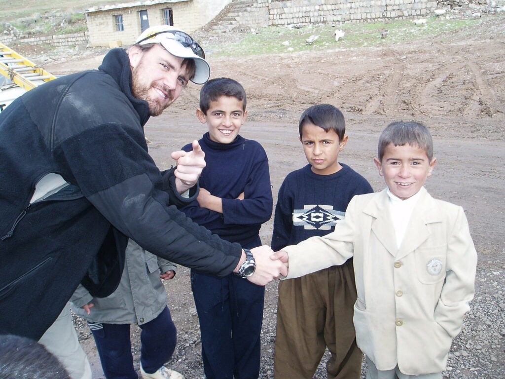 Lerette with kids in Iraq