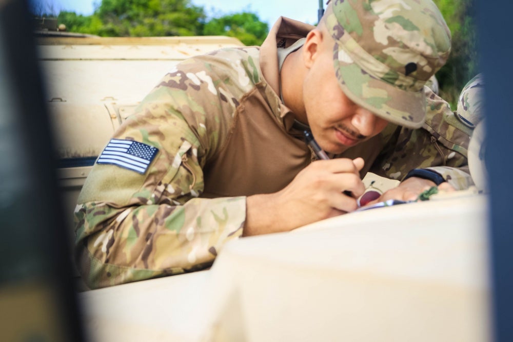 soldier filling out paperwork pretending to be dumb