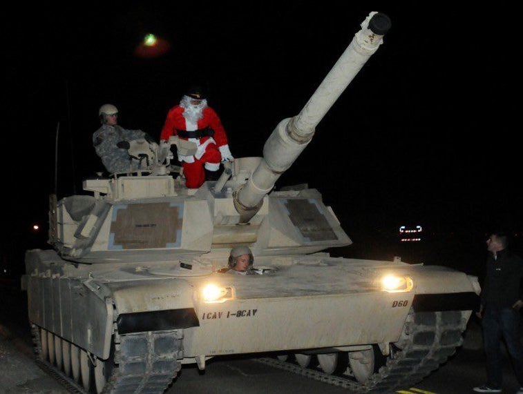 13 Photos Of Santa Hanging With The Troops