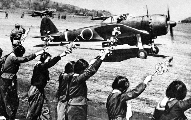  A Nakajima Ki-43-III-Ko Oscar takes off as young girls wave. The plane was sent on a kamikaze mission against the American fleet off Okinawa. (Wikimedia Commons)