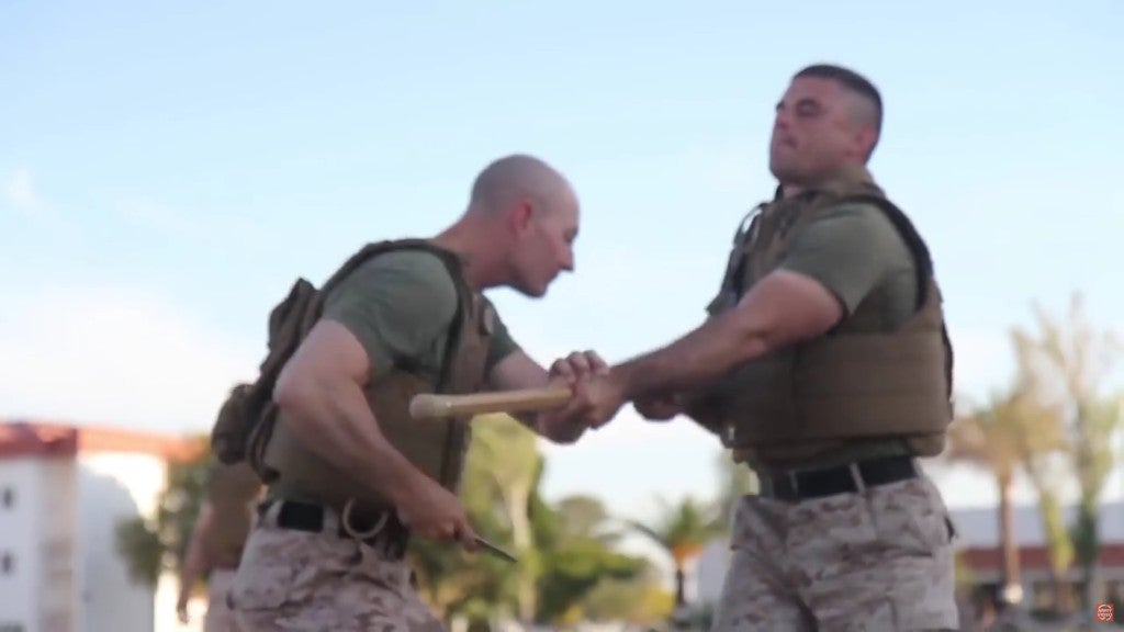 Marines practicing knife fighting