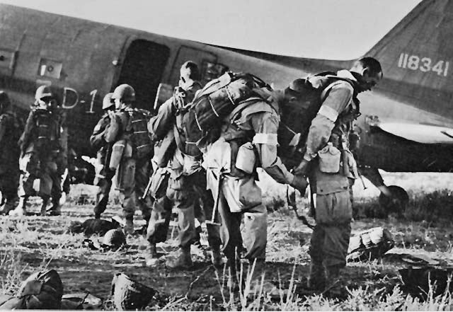 paratroopers boarding a plane for a combat jump