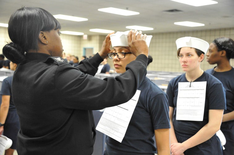 First female recruits issued “Dixie cup” covers at RTC
