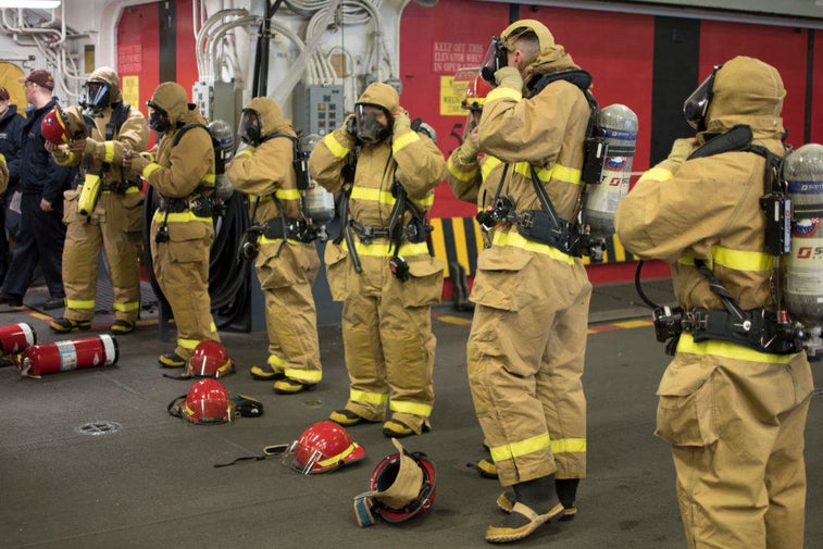16 intense photos that show how sailors fight fires at sea
