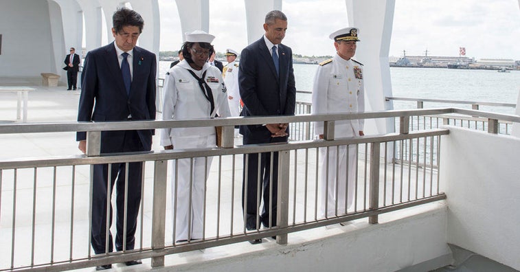 Japanese prime minister pays his respects at Pearl Harbor in solemn ceremony