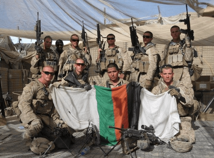infantrymen holding the flag of their enemies