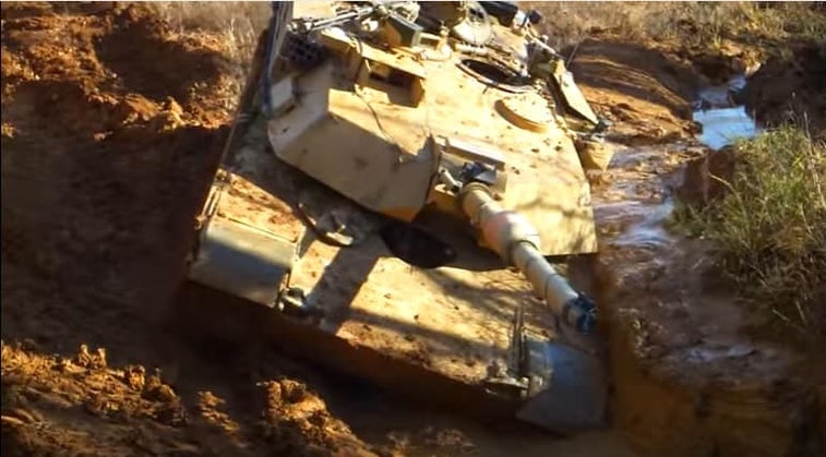 This poor Abrams tank got stuck in the mud — then got un-stuck