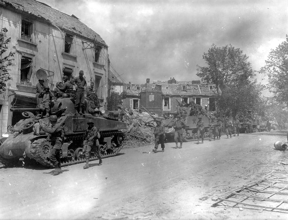  Tanks from the 4th Armored Divisions and American infantry move through Alsace-Lorraine in World War II.  These soldiers had several nicknames