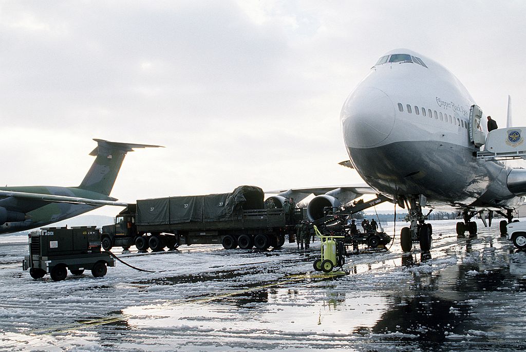  Airmen load gear and personnel aboard a CRAF Pan Am jumbo jet at Ramstein Air Base, Germany, for deployment to Saudi Arabia (Photo US Air Force)