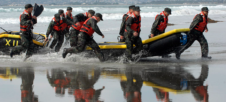 BUD/S students rush to get their inflatable boats to the finish line during a surf passage evolution. BUD/S students must endure 27 weeks of intense training in order to graduate.

(Photo by MC2 Marcos T. Hernandez)