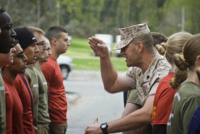 A drill sergeant uses his "knife hand" to yell at recruits
