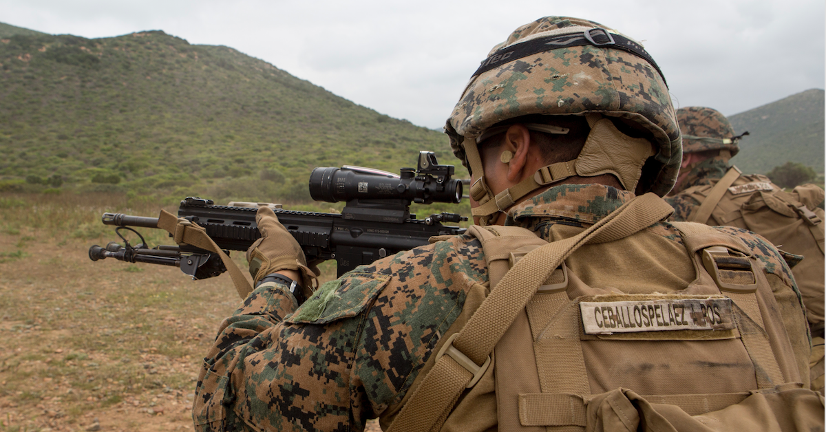 marine aiming an automatic rifle