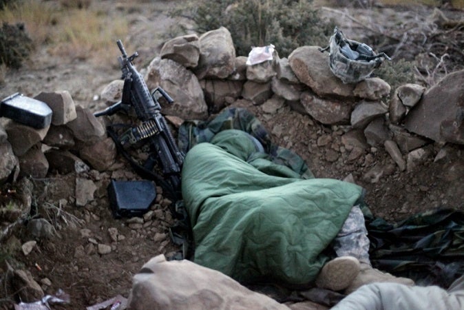 Soldiers joining the military shouldn't expect to be in charge. This one is sleeping on the ground.