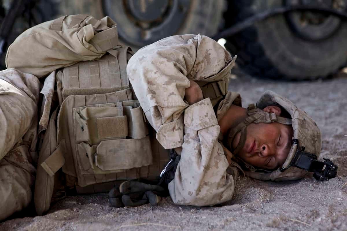 marine sleeping on the ground