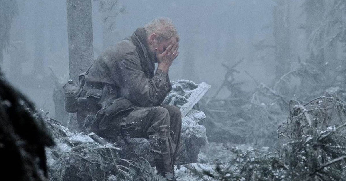 Screenshot from Band of Brothers. Soldier with his head in his hands.