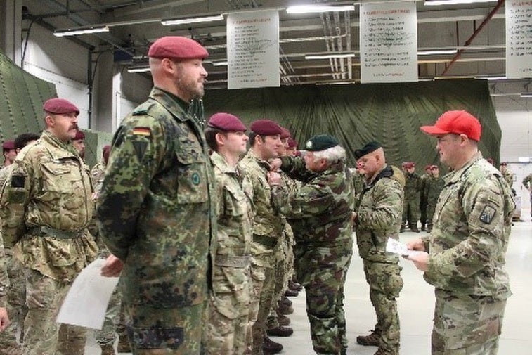 Paratroopers jump with Santa Claus and gift presents to kids