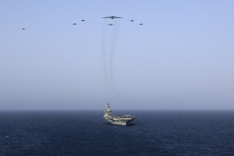 US aircraft carrier, bombers and fighters flex their muscles near Iran