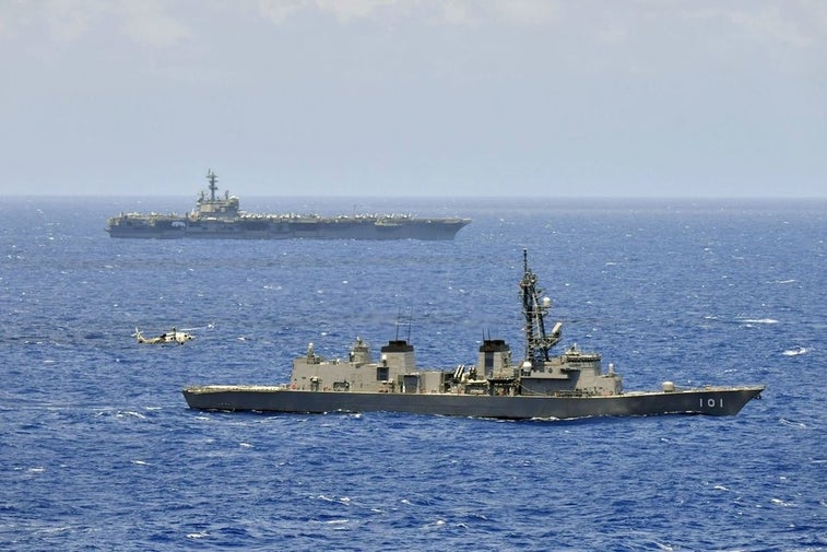 US aircraft carrier and Japanese warships sail together in South China Sea