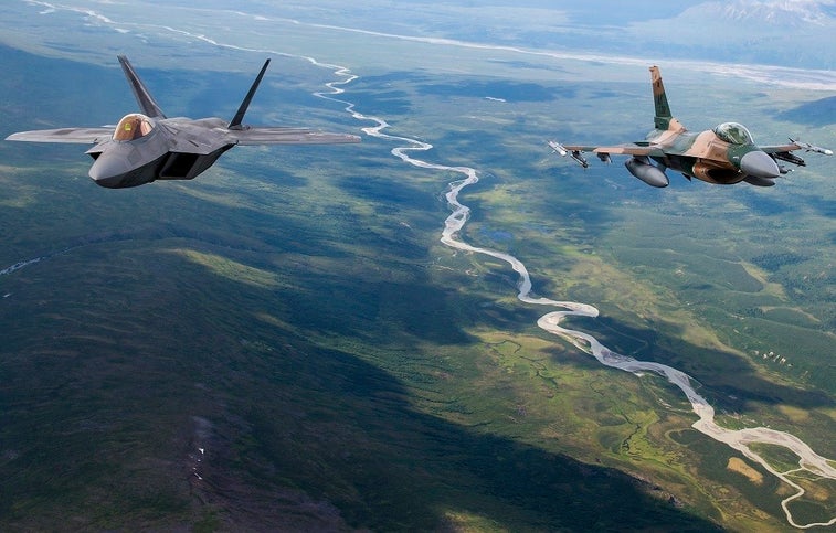 Check out these amazing photos of F-22s and F-16s flying over Alaska