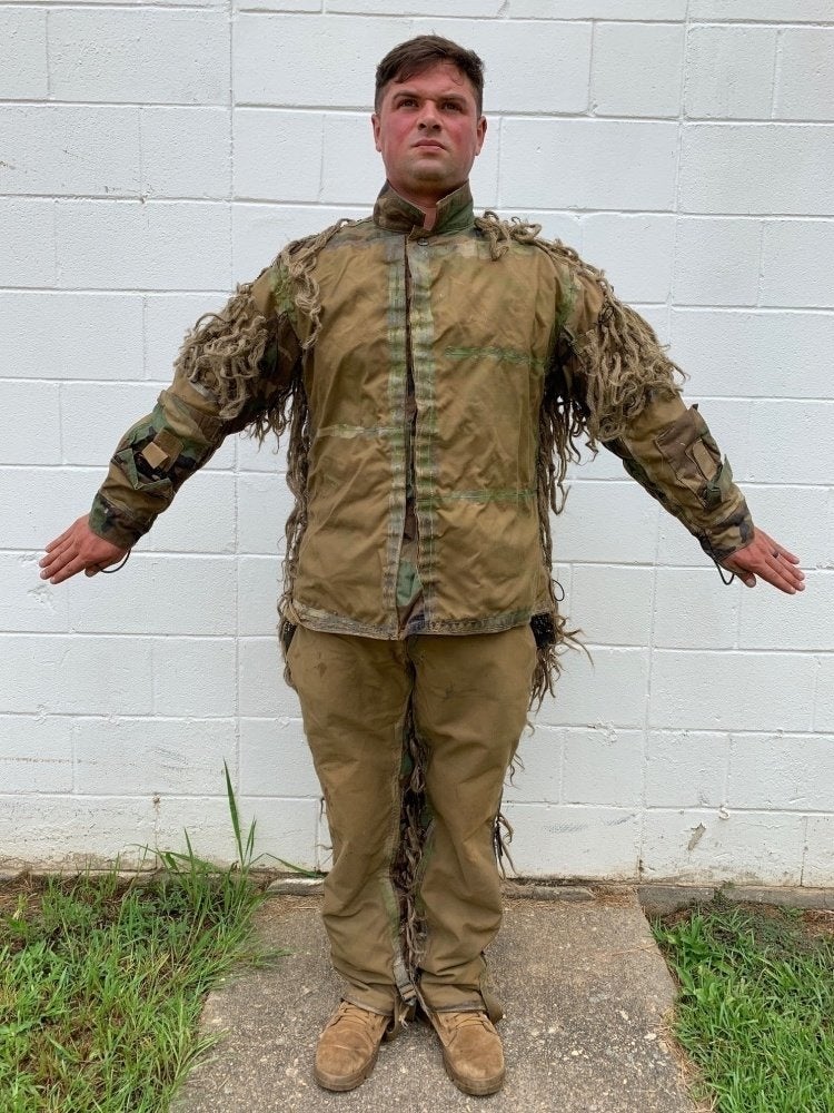 This soldier’s wild-looking ghillie suit makes him a deadly force