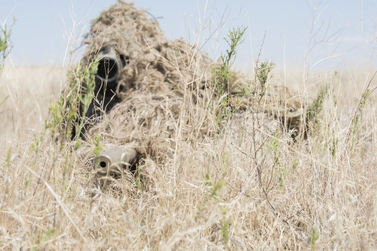 This soldier’s wild-looking ghillie suit makes him a deadly force