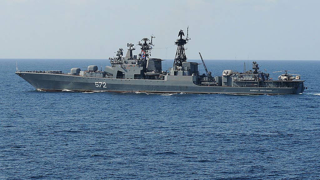 The Russian destroyer Admiral Vinogradov (DDG 572) is underway near the guided-missile cruiser USS Vella Gulf (CG 72) while conducting operations in the Gulf of Aden. Vella Gulf is the flagship for Combined Task Force 151, a multi-national task force conducting counterpiracy operations to detect and deter piracy in and around the Gulf of Aden, Persian Gulf, Indian Ocean and Red Sea. (U.S. Navy photo by Mass Communications Specialist 2nd Class Jason R. Zalasky/Released)