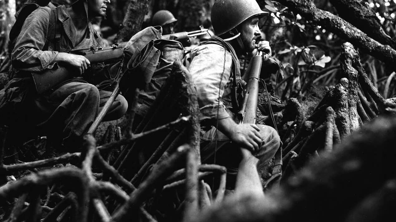 Vella Lavella. Infantrymen of Co. "I" await the word to advance in pursuit of retreating Japanese forces. Stepping Stone Island on the Vella Lavella Island Front, Southwest Pacific. (13 Sep 43). (Signal Corps Photo)