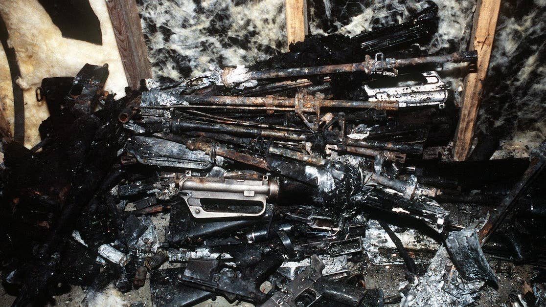 Charred weapons recovered from the wreckage of an Arrow Air DC-8 commercial aircraft are stored in a Gander Airport hangar for analysis by members of the Canadian Air Safety Board. The aircraft crashed at the airport with no survivors on December 12, 1985, while carrying 248 members of the 3rd Bn., 502nd Inf., 101st Airborne Div. They were returning to the United States after participating in peacekeeping duty with the Multi-national Force and Observers in the Sinai Desert. (Wikimedia Commons)