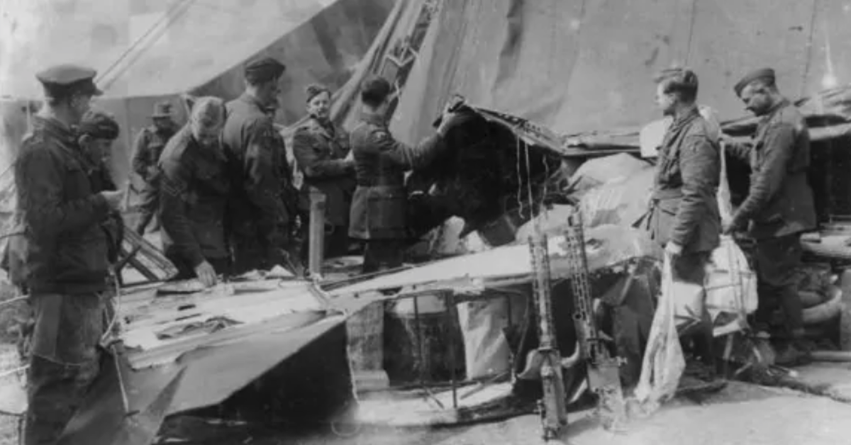 Copy print of a well-known photograph of airmen at Bertangles stripping the remains of Richthofen's wrecked Fokker Dr.1 Triplane and his two Spandau machine-guns, 22 April 1918. Salvaged by No. 3 Squadron, Australian Flying Corps. From the collection of the Air Force Museum of New Zealand.