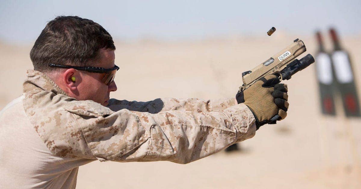 A US Marine fires an M1911 during a training exercise, January 22, 2016. US Marine Corps/Cpl. Joshua W. Brown
