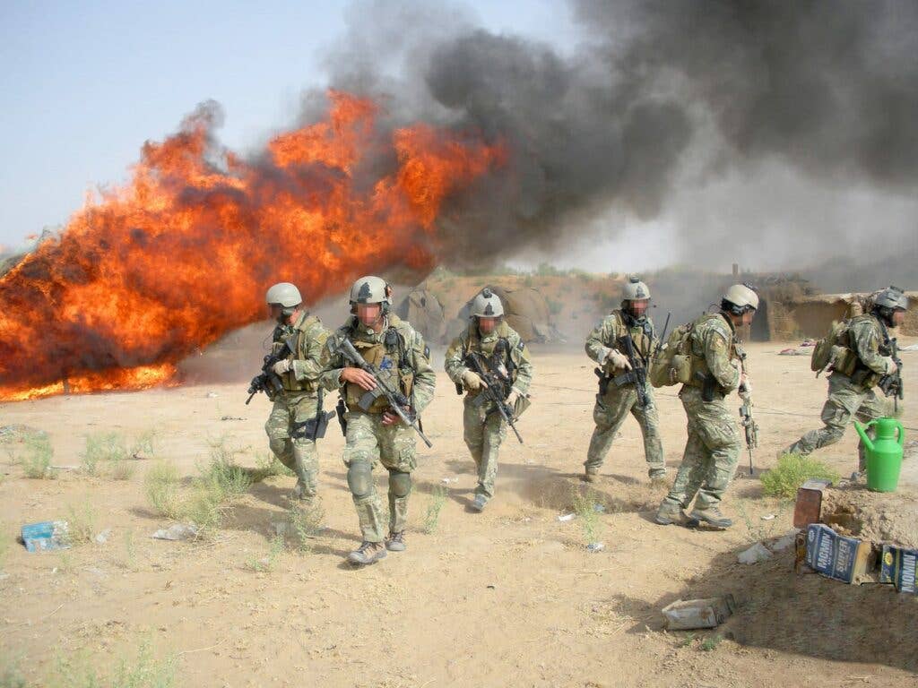 DEA agents burning hashish seized in Operation Albatross, a joint Afghan, NATO, and DEA operation, in 2008. DEA