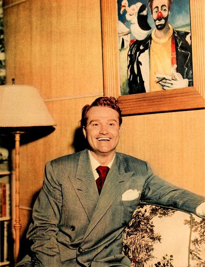 Red Skelton with one of his clown paintings in 1948. Photo credit Wikipedia.