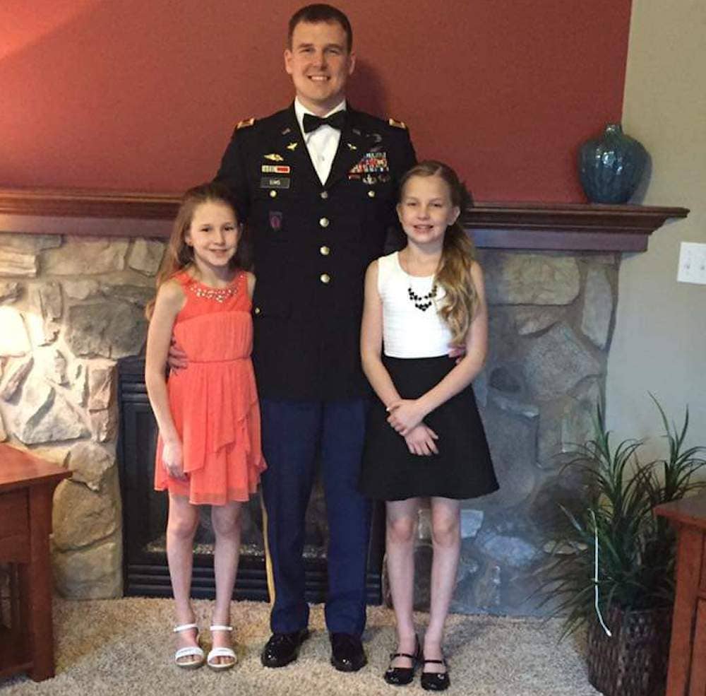 Jacob Sims with two of his five children. Photo courtesy of Alicia Sims.