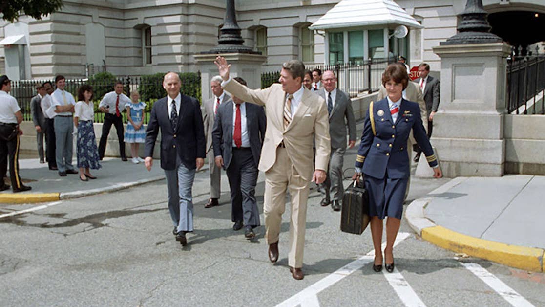8/3/1987 President Reagan Vivien Crea with the Football and Ken Duberstein Walking from the OEOB back to the White House