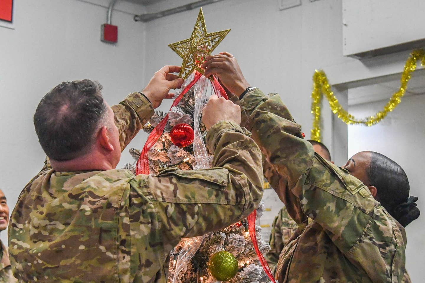 Task Force Destiny Soldiers bring the holiday cheer and spirit as they set up a Christmas tree for the TF Destiny building at Bagram Airfield, Afghanistan Dec. 6, 2018.