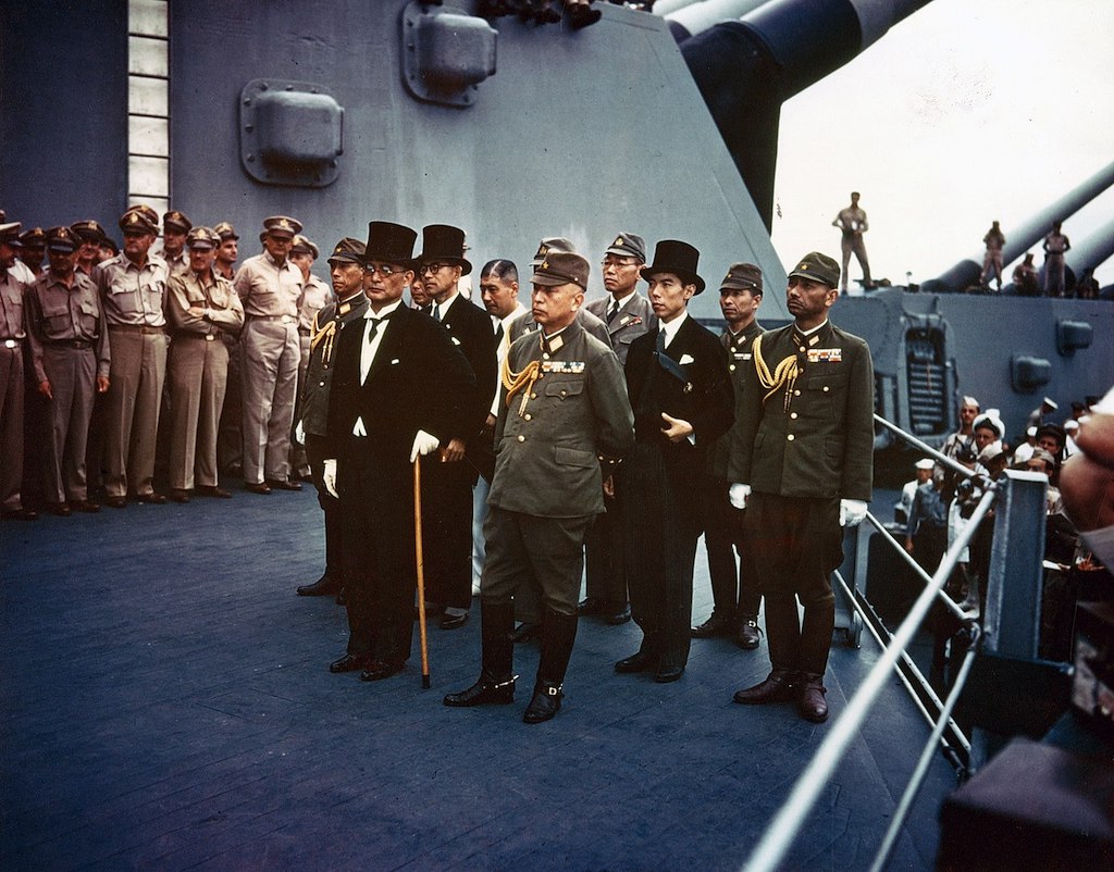 Representatives of the Empire of Japan stand aboard USS Missouri prior to signing of the Instrument of Surrender. (Photograph from the Army Signal Corps Collection in the U.S. National Archives)