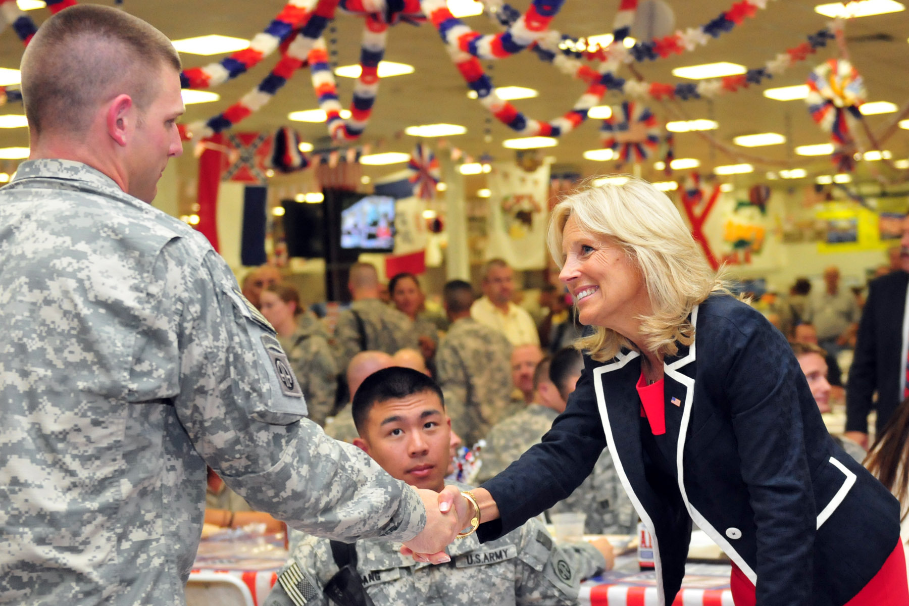 (2010) Dr. Jill Biden mingles with soldiers at the Sports Oasis dining facility on Camp Victory July 4. Photo by Sgt. Teri Hansen