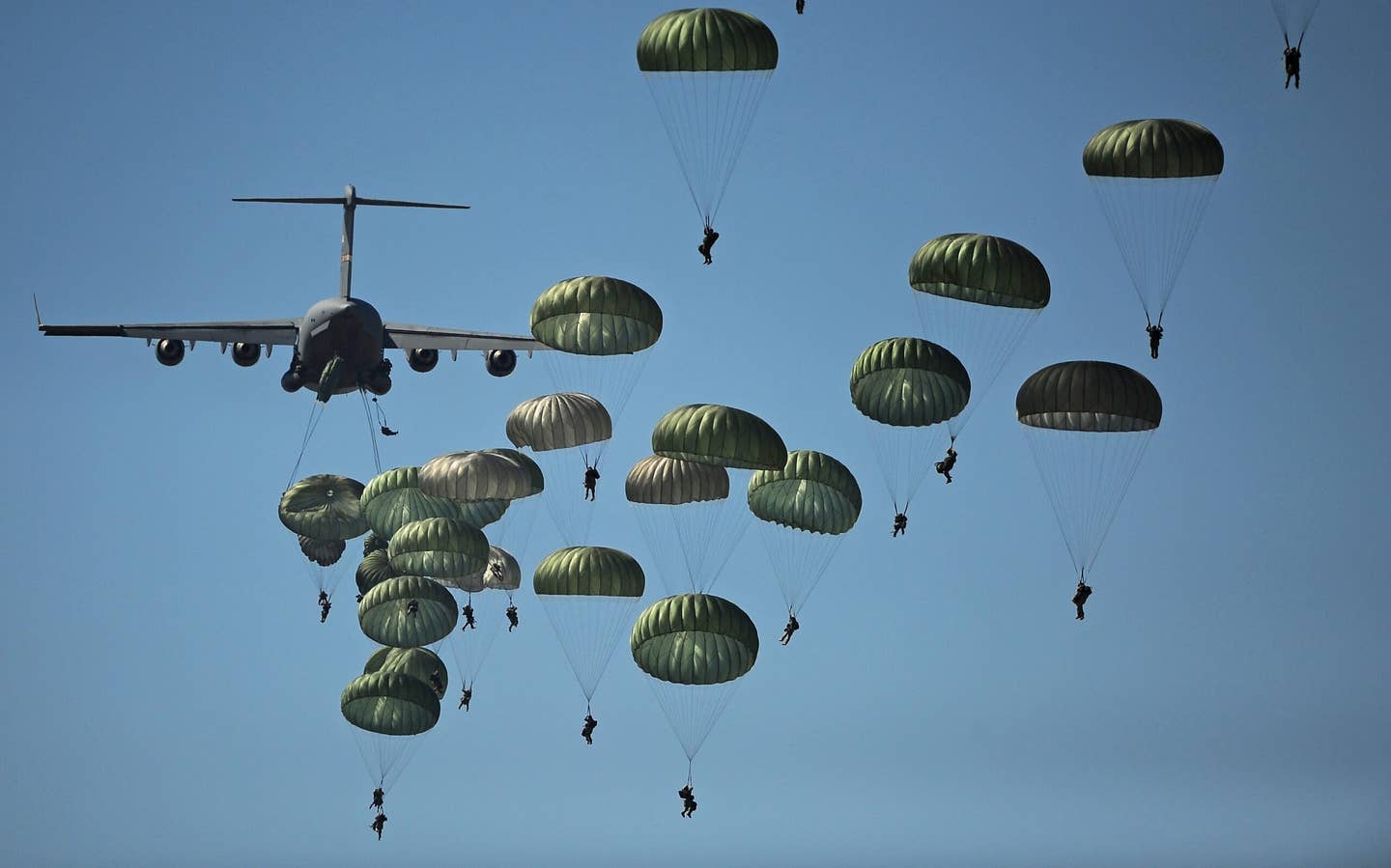 Paratroopers launching from a plane