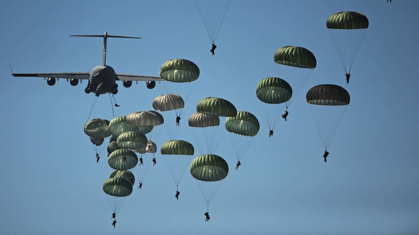 Paratroopers launching from a plane