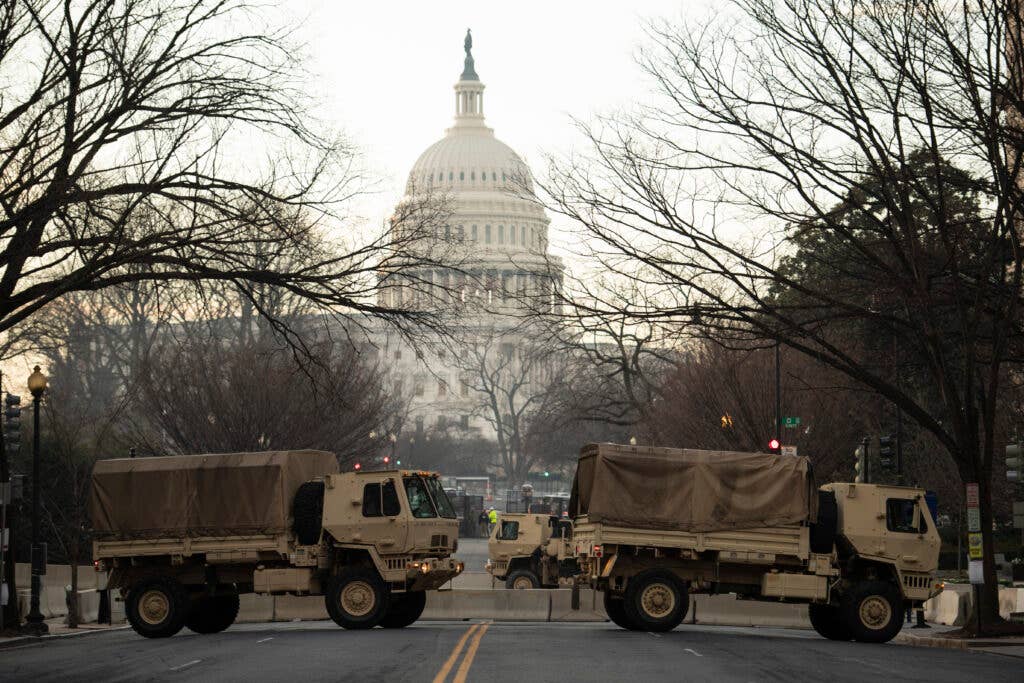 U.S. Soldiers with the National Guard assist law enforcement agencies with roadblocks near the U.S. Capitol Jan. 14, 2021, in Washington, D.C. National Guard Soldiers and Airmen from several states have traveled to Washington to provide support to federal and district authorities leading up to the 59th Presidential Inauguration. (U.S. Air National Guard photo by Staff Sgt. Bryan Myhr)