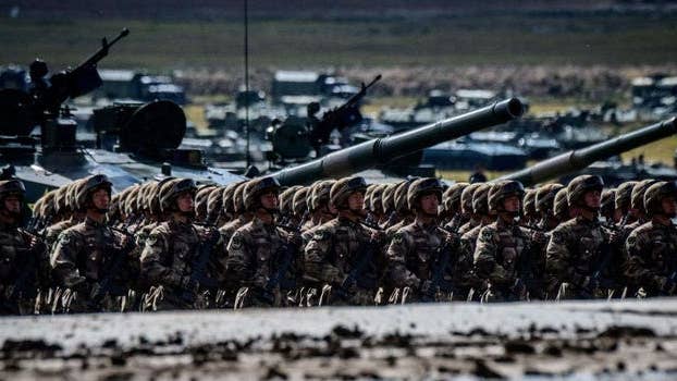 A 40-ton armored vehicle drives over Chinese troops in this intense video of a really unusual trust exercise