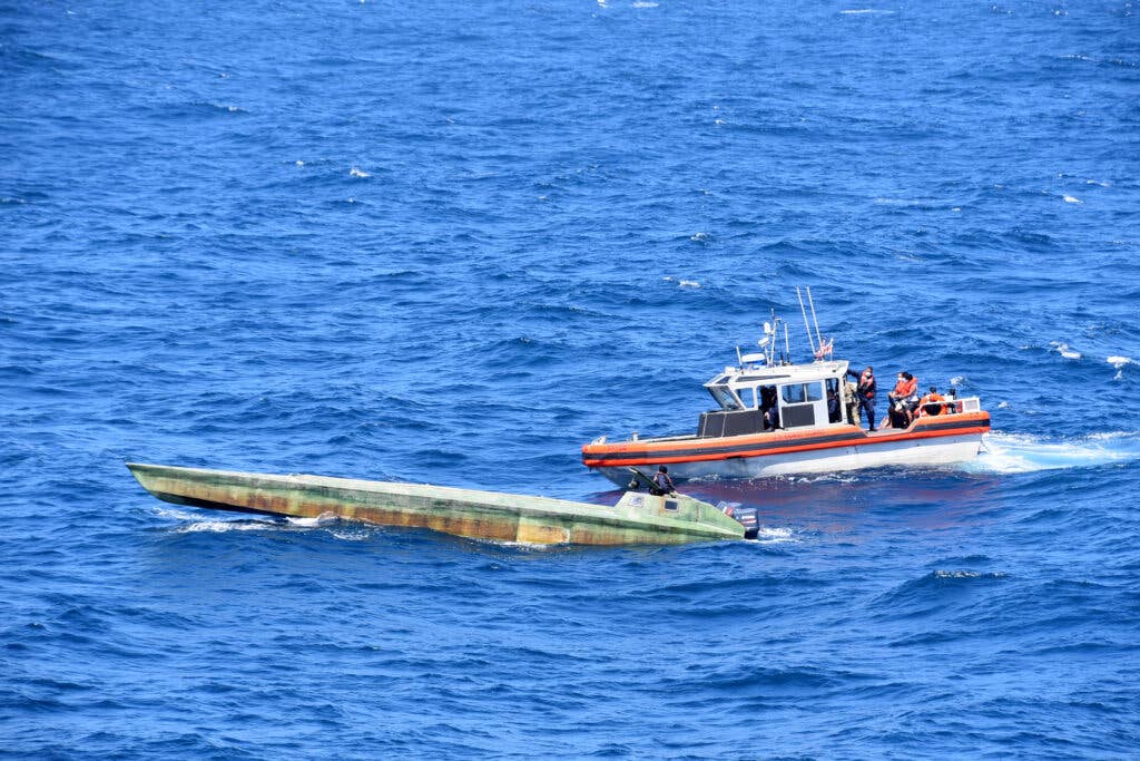 Coast Guard Cutter Bertholf (WMSL 750) boarding teams interdict a low-profile vessel in the Eastern Pacific Ocean, seizing more than 4,380 pounds of cocaine
