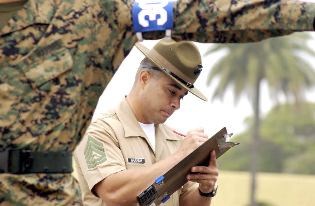 US Marine Corps (USMC) Gunnery Sergeant (GYSGT Christopher T. Balcazar, a Drill Master aboard Marine Corps Recruit Depot (MCRD) San Diego, California (CA), grades recruits from Lima/Company during their final drill.