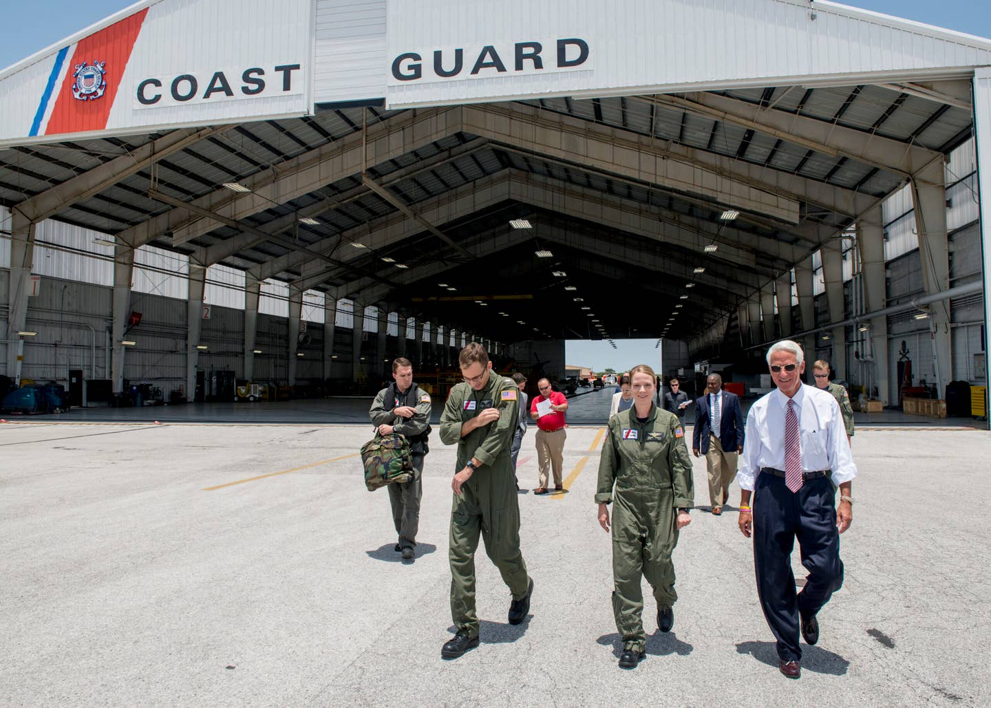 Congressman Charlie Crist, U.S. Representative for Florida's 13th District, right, speaks with Air Station Clearwater crew members Tuesday, May 30, 2017, prior to an aerial assessment of beach erosion along Pinellas County, Florida’s coast. Coast Guard Air Station Clearwater MH-60 Jayhawk helicopter crew members provided the overflight for the congressman and Army Corps of Engineers personnel. U.S. Coast Guard by Petty Officer 1st Class Michael De Nyse