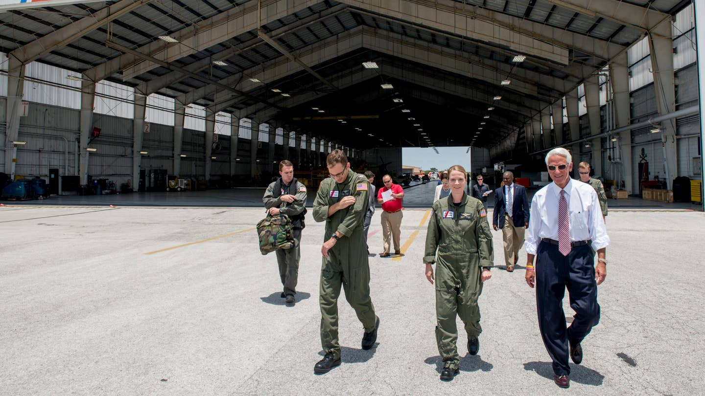 Congressman Charlie Crist, U.S. Representative for Florida's 13th District, right, speaks with Air Station Clearwater crew members Tuesday, May 30, 2017, prior to an aerial assessment of beach erosion along Pinellas County, Florida’s coast. Coast Guard Air Station Clearwater MH-60 Jayhawk helicopter crew members provided the overflight for the congressman and Army Corps of Engineers personnel. U.S. Coast Guard by Petty Officer 1st Class Michael De Nyse