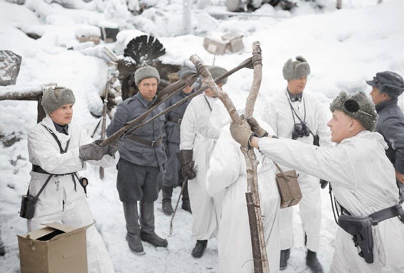Finnish Soldiers during the Winter War using a slingshot to lob grenades at the Soviets. (Cassowary Colorizations, Flickr) https://www.flickr.com/photos/cassowaryprods/34868887994