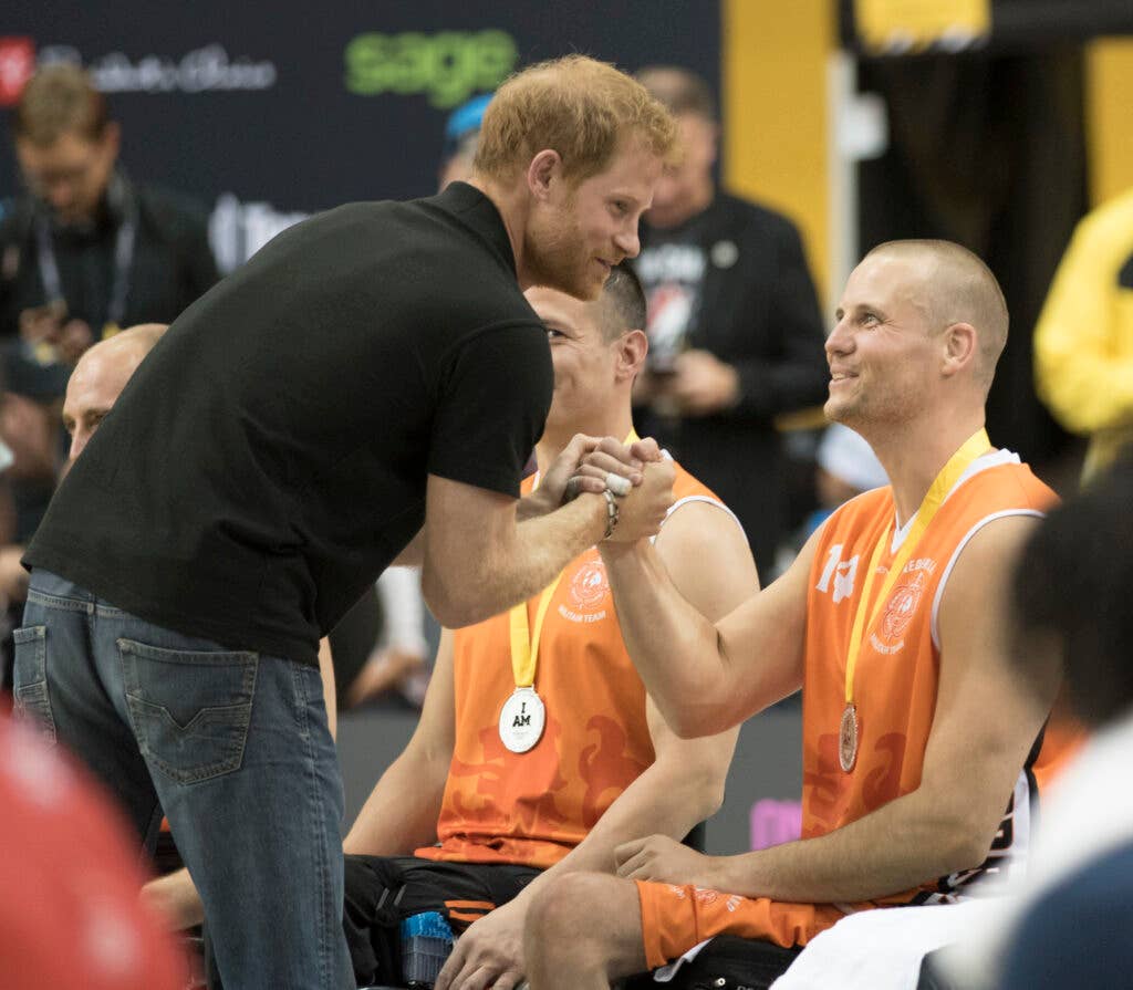 Prince Harry awards silver medals to the Netherlands for Wheelchair Basketball at the Mattamy Centre during the 2017 Invictus Games in Toronto on September 30, 2017. The Invictus Games, established by Prince Harry in 2014, brings together wounded and injured veterans from 17 nations for 12 adaptive sporting events, including track and field, wheelchair basketball, wheelchair rugby, swimming, sitting volleyball, and new to the 2017 games, golf.    (DoD photo by Roger L. Wollenberg)