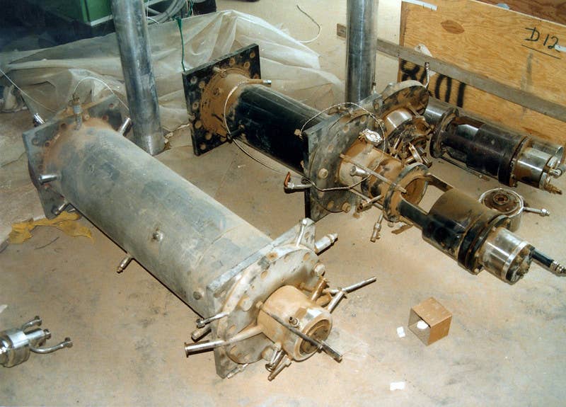 Centrifuges found in a warehouse near Tuwaitha, Iraq that could be used to seperate high-grade Uranium from natural Uranium. Similar centrifuges were damaged in Iran, setting back their nuclear program substantially. <em>(Action Team 1991-1998 / IAEA, Flickr)</em>