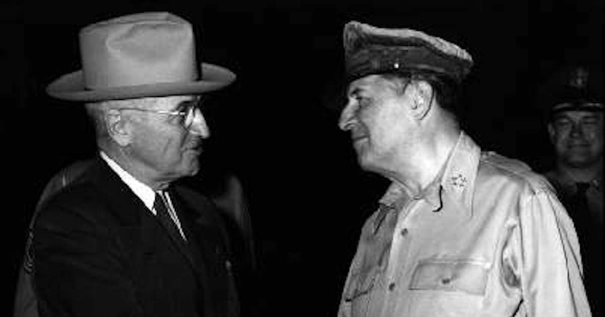 President Truman and General MacArthur shake hands