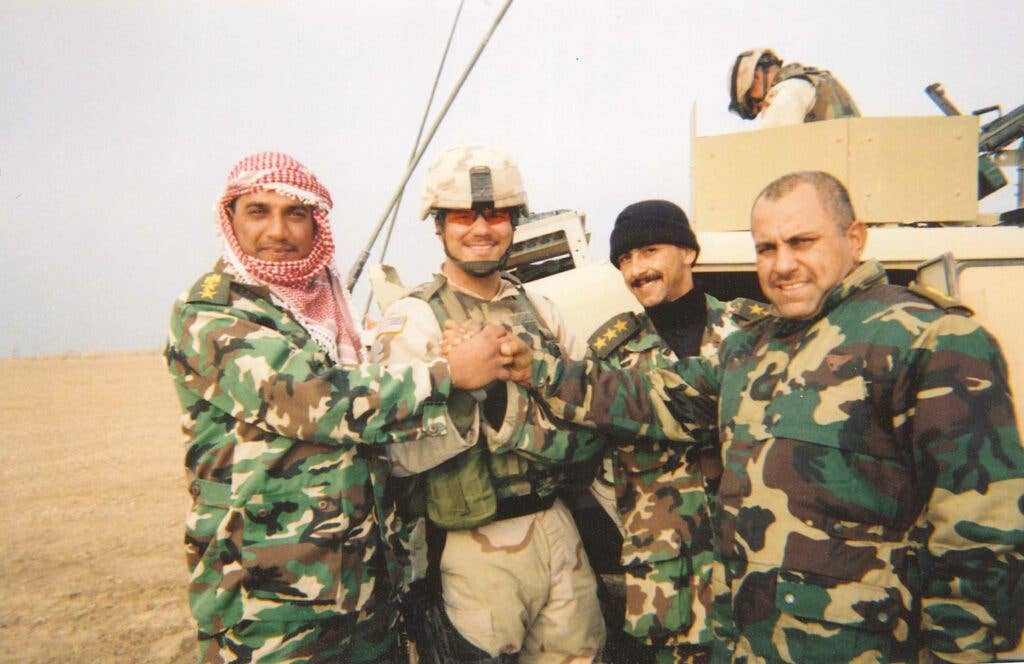 Photo provided by USAA. Engquist is second from the left during deployment to Fallujah, Iraq in 2004.